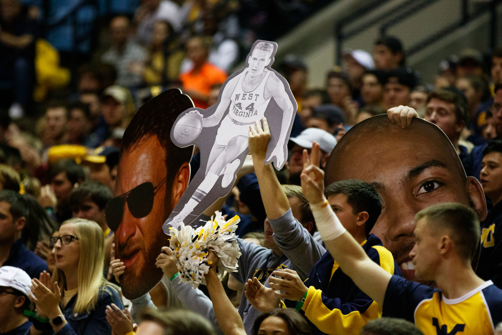 A cardboard cutout of Jerry West is held by a fan during West Virginia's season opener against Akron on Nov. 8, 2019 at the WVU Coliseum.
